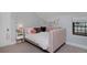 Charming bedroom features a bed with a unique headboard and soft lighting at 239 Ash St, Denver, CO 80220