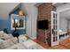 Inviting bedroom with a brick accent wall and connecting door to another room at 239 Ash St, Denver, CO 80220