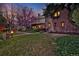 Beautifully landscaped front yard with a classic brick home and inviting curb appeal at 239 Ash St, Denver, CO 80220