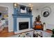 Close-up of the fireplace featuring a cozy reading nook and lots of natural light at 239 Ash St, Denver, CO 80220