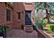 Inviting brick entryway with potted plants and a decorative front door at 239 Ash St, Denver, CO 80220