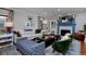 Sunlit living room featuring a fireplace, comfortable seating, and elegant decor elements at 239 Ash St, Denver, CO 80220