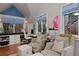 Cozy living room featuring comfortable seating, large windows, and a tranquil ambiance at 239 Ash St, Denver, CO 80220