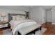 This main bedroom features hardwood floors, stylish décor, and a serene ambiance at 239 Ash St, Denver, CO 80220