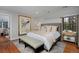 Relaxing main bedroom with a plush bed, a patterned rug, and a serene atmosphere at 239 Ash St, Denver, CO 80220