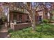 Charming outdoor patio with lush landscaping and space for seating at 239 Ash St, Denver, CO 80220