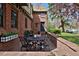 Charming outdoor patio features a table and chairs for relaxation and entertaining at 239 Ash St, Denver, CO 80220