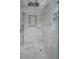 Luxurious shower adorned with white marble tiling and a built-in seating area at 239 Ash St, Denver, CO 80220