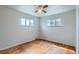 Cozy bedroom with hardwood floors and two windows offering ample natural light at 925 Quitman St, Denver, CO 80204