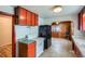 Functional kitchen featuring white appliances and cabinets providing ample storage space at 925 Quitman St, Denver, CO 80204