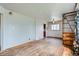 Spacious living room with hardwood floors, ample natural light, and unique wood shelving at 925 Quitman St, Denver, CO 80204