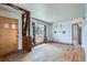 Comfortable living room featuring hardwood floors, a bright window, and a unique wall shelf at 925 Quitman St, Denver, CO 80204