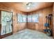 Functional mud room with wood paneled walls and ceiling and durable tile flooring at 925 Quitman St, Denver, CO 80204