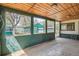 View of the open patio area showcasing a wood ceiling and views of neighboring houses and their yards at 925 Quitman St, Denver, CO 80204