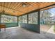 Covered patio with wood ceilings and view of backyard and shed at 925 Quitman St, Denver, CO 80204
