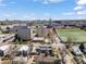 Expansive aerial view of a vibrant urban landscape with a mix of residential and institutional buildings under a bright, partly cloudy sky at 1833 E Jewell Ave, Denver, CO 80210