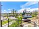 Balcony view overlooking the neighborhood with lush greenery and blue skies at 1833 E Jewell Ave, Denver, CO 80210