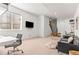 Bright basement featuring comfortable seating, workspace, and natural light, perfect for flexible living arrangements at 1833 E Jewell Ave, Denver, CO 80210