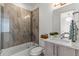 Modern bathroom features a stylish tiled shower, vanity, and contemporary fixtures at 1833 E Jewell Ave, Denver, CO 80210