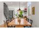 Open dining and living area with hardwood floors and natural light at 1833 E Jewell Ave, Denver, CO 80210
