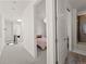 Bright hallway with views into a bedroom and bathroom at 1833 E Jewell Ave, Denver, CO 80210