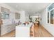Modern kitchen with a large island and views through to the dining room at 1833 E Jewell Ave, Denver, CO 80210