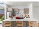 Bright kitchen featuring stainless steel appliances, modern cabinets, and a large quartz island at 1833 E Jewell Ave, Denver, CO 80210