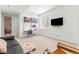 Bright living room featuring a built-in desk, sleek furnishings, and plenty of natural light at 1833 E Jewell Ave, Denver, CO 80210
