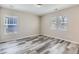 Light filled bedroom with new floors and large windows at 17244 E Kansas Dr, Aurora, CO 80017