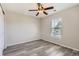 Bedroom featuring new floors, a ceiling fan, and a sliding closet door at 17244 E Kansas Dr, Aurora, CO 80017