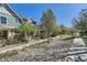 Landscaped community features mature trees and manicured walkway and well maintained exteriors on a sunny day at 17244 E Kansas Dr, Aurora, CO 80017
