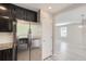 Well-designed kitchen with stainless steel refrigerator and easy access to the dining area, perfect for seamless entertaining at 17244 E Kansas Dr, Aurora, CO 80017