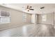 Bright living room boasts new floors, neutral walls, and a modern ceiling fan at 17244 E Kansas Dr, Aurora, CO 80017