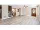 Open-concept living room featuring modern flooring, neutral walls, and an inviting atmosphere for relaxing and entertaining at 17244 E Kansas Dr, Aurora, CO 80017