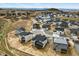 An aerial view of a new neighborhood featuring houses in varying stages of construction at 5698 Farrier Pt, Castle Rock, CO 80104