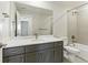 Modern bathroom with shower and bathtub combination and single sink vanity at 5698 Farrier Pt, Castle Rock, CO 80104