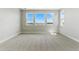 Bright bedroom with large windows providing natural light and scenic views at 5698 Farrier Pt, Castle Rock, CO 80104