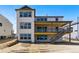 New construction home featuring a large deck, gray wood style siding, and many windows at 5698 Farrier Pt, Castle Rock, CO 80104