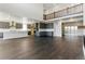 Spacious open-concept kitchen features a large island, stainless steel appliances, and modern cabinetry at 5698 Farrier Pt, Castle Rock, CO 80104