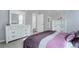 Serene bedroom with white dressers, cozy bedding, and soft natural light at 11568 Dewey St, Parker, CO 80138