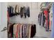 Walk-in closet features ample shelving and hanging space for organized storage at 11568 Dewey St, Parker, CO 80138