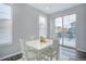 Dining room featuring a white table set, natural light, and sliding door access to backyard at 11568 Dewey St, Parker, CO 80138