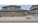 Exterior view of home with attached garage, landscaped yard, and contemporary design shows functional curb appeal at 11568 Dewey St, Parker, CO 80138