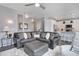 Stylish living room blending seamlessly into the kitchen, featuring modern decor and an open layout at 11568 Dewey St, Parker, CO 80138