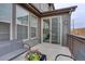 Relaxing patio with sliding glass door access to the home provides indoor-outdoor living with comfortable seating at 11568 Dewey St, Parker, CO 80138