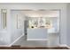 Modern kitchen with stainless steel appliances, butcher block countertops, and open layout at 8240 Grandview Ave, Arvada, CO 80002