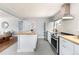 Contemporary kitchen with stainless steel appliances, butcher block countertops, and convenient island at 8240 Grandview Ave, Arvada, CO 80002