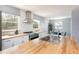 Bright kitchen featuring stainless steel appliances, butcher block counters, and a view to the dining area at 8240 Grandview Ave, Arvada, CO 80002