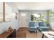 Bright living room area with plenty of natural light, hardwood floors and stylish decor at 8240 Grandview Ave, Arvada, CO 80002