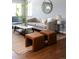 Comfortable living room featuring plush seating, natural light, hardwood flooring, and chic decor at 8240 Grandview Ave, Arvada, CO 80002